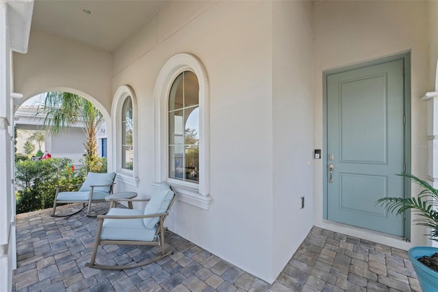 doorway to property featuring a porch