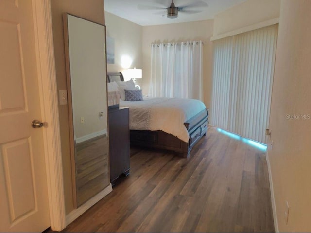 bedroom featuring ceiling fan and dark wood-type flooring