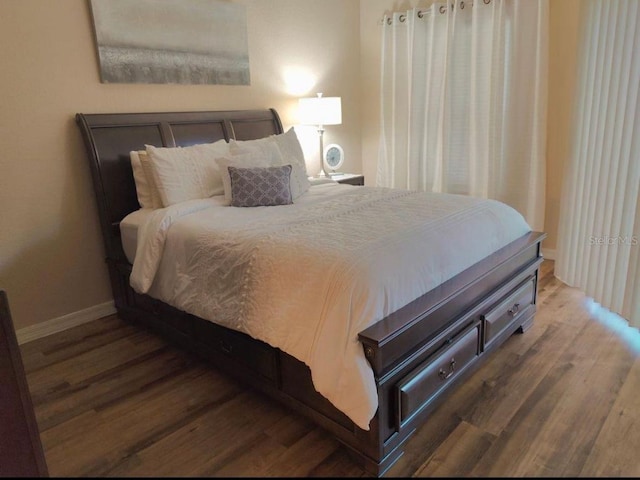 bedroom featuring dark wood-type flooring