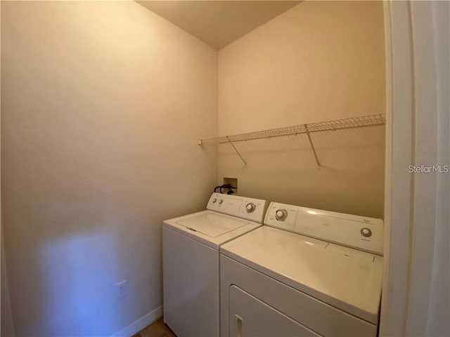 clothes washing area featuring washer and dryer