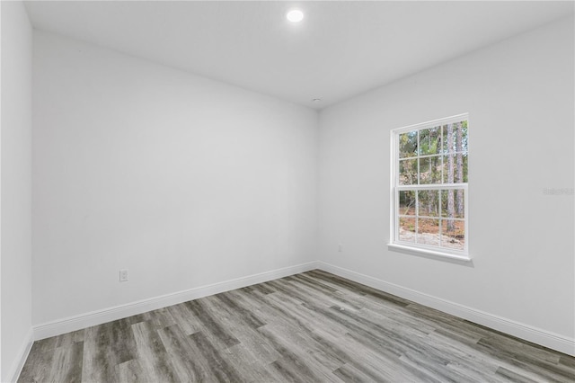 unfurnished room with light wood-type flooring