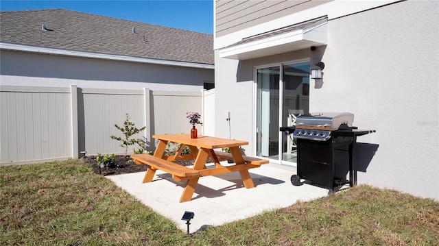 view of patio featuring a grill