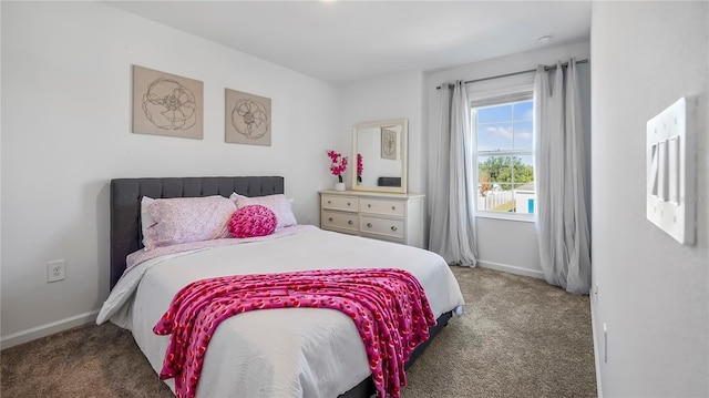 bedroom featuring dark colored carpet