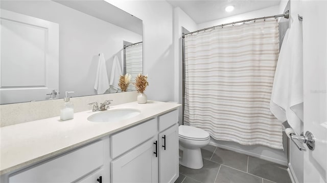 full bathroom with toilet, vanity, tile patterned flooring, and shower / bath combo with shower curtain