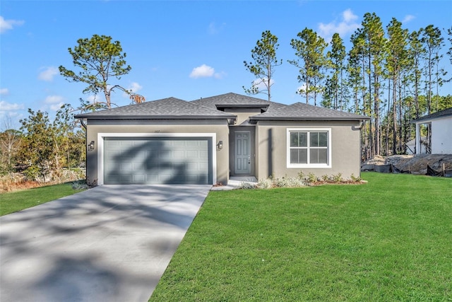 view of front of property with a front yard and a garage