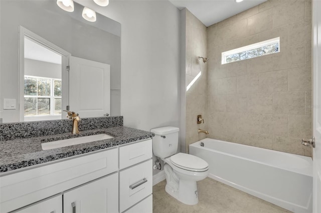 full bathroom with vanity, tiled shower / bath combo, toilet, and tile patterned flooring