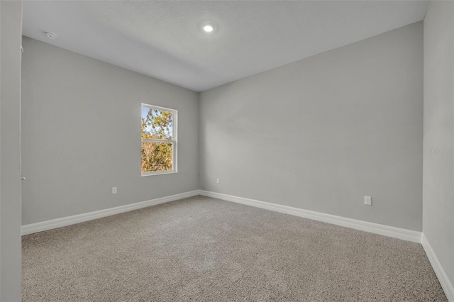 spare room featuring carpet flooring