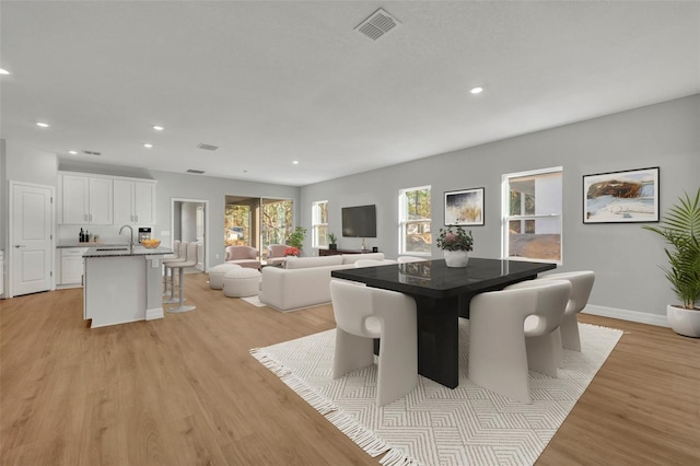1607 W Diamond Dr, Citrus Springs, FL 34434 - dining space with light wood-style flooring, recessed lighting, and baseboards