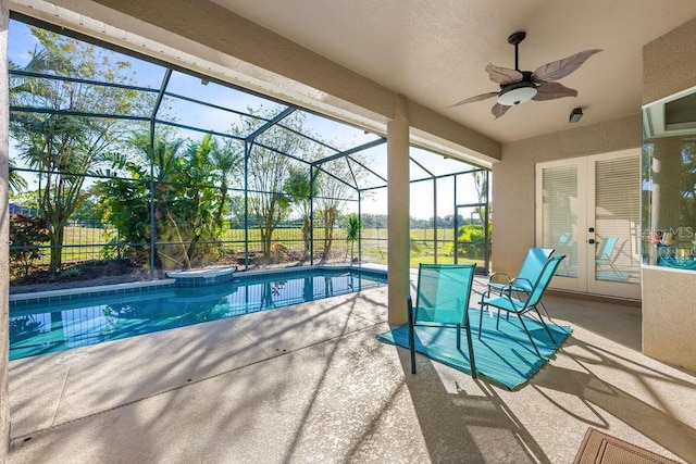 view of pool featuring a lanai, ceiling fan, and a patio area