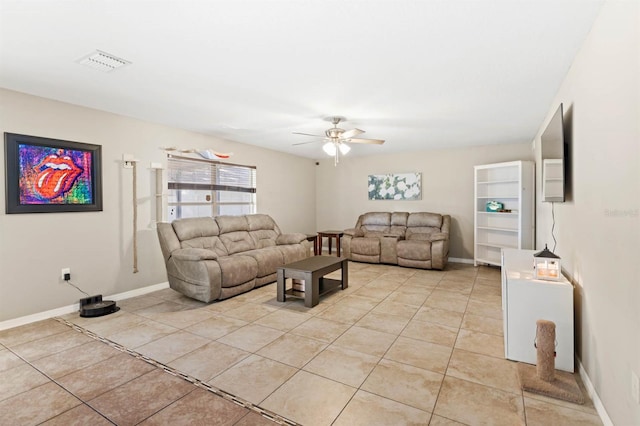 living room with ceiling fan and light tile patterned floors