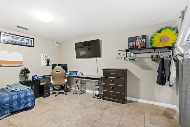 tiled office with a textured ceiling