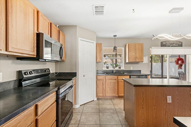 kitchen featuring sink, a kitchen island, decorative light fixtures, light tile patterned floors, and appliances with stainless steel finishes