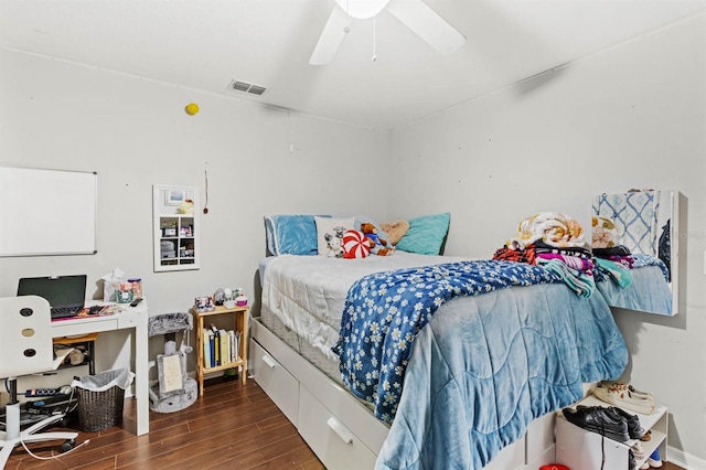 bedroom featuring ceiling fan and dark hardwood / wood-style floors