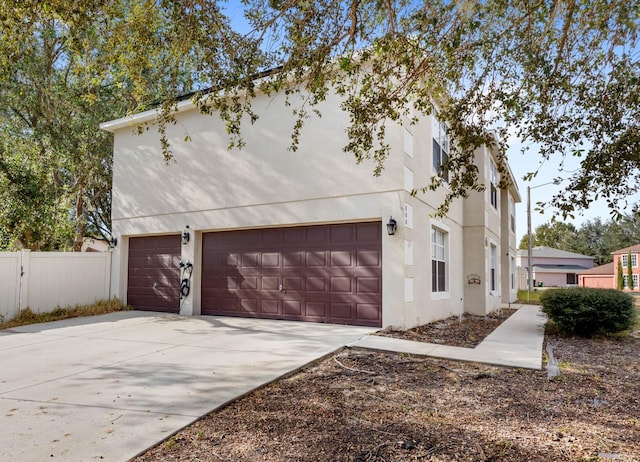 view of side of property featuring a garage