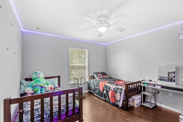 bedroom featuring hardwood / wood-style flooring and ceiling fan