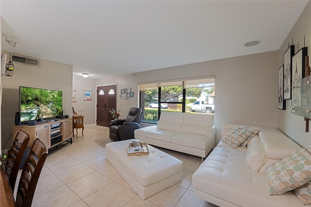 living room with light tile patterned floors