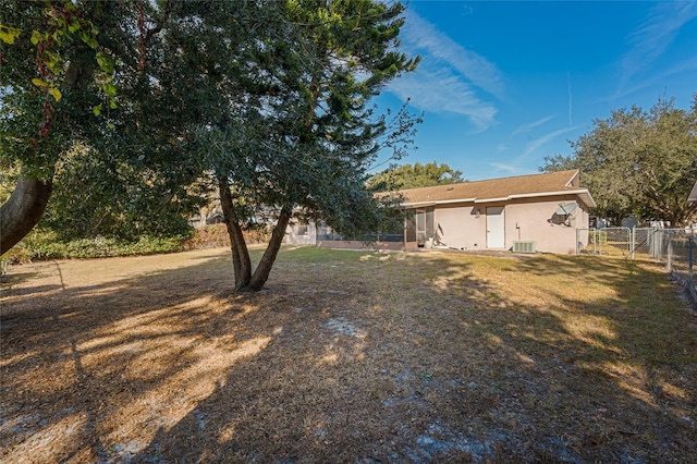 view of yard with central AC