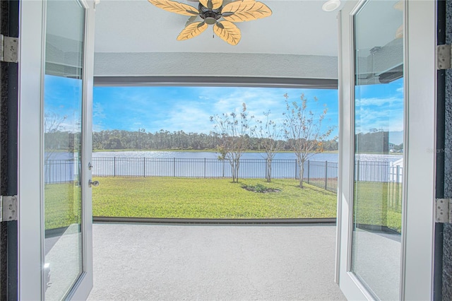 interior space featuring a water view and carpet floors