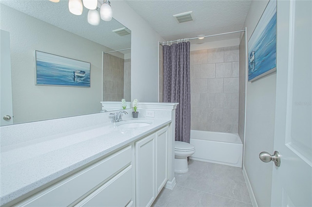 full bathroom with vanity, tile patterned floors, toilet, a textured ceiling, and shower / tub combo