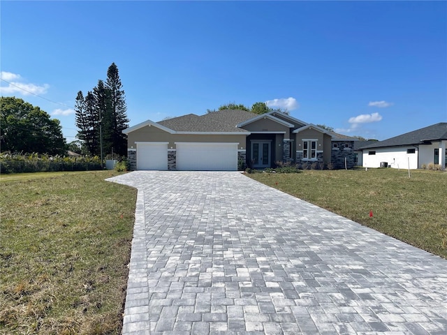 ranch-style home with a garage and a front yard