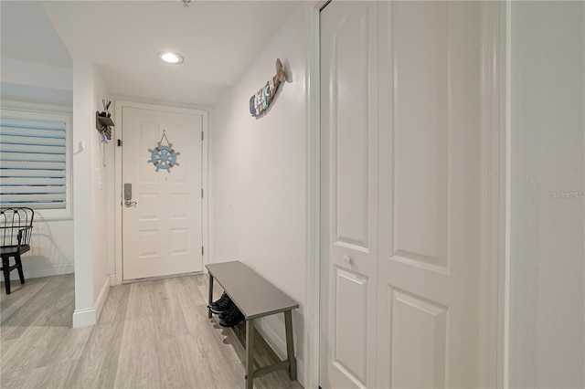 doorway to outside with light wood-type flooring