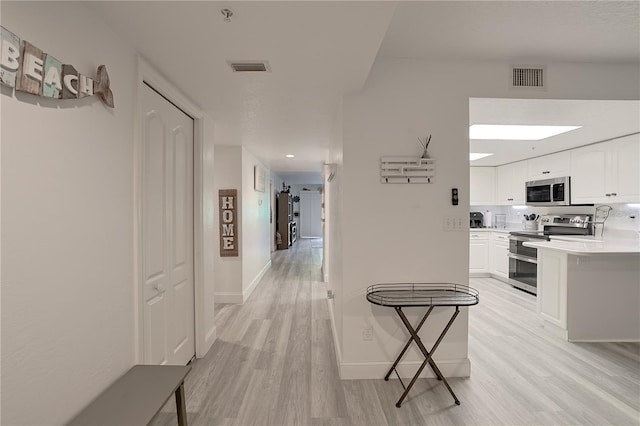 hallway featuring light hardwood / wood-style floors