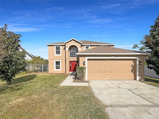 front of property featuring a garage and a front lawn