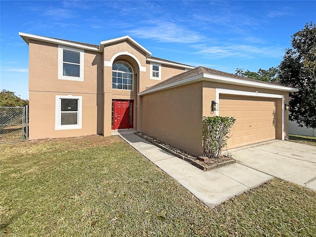 view of front of property featuring a front yard and a garage