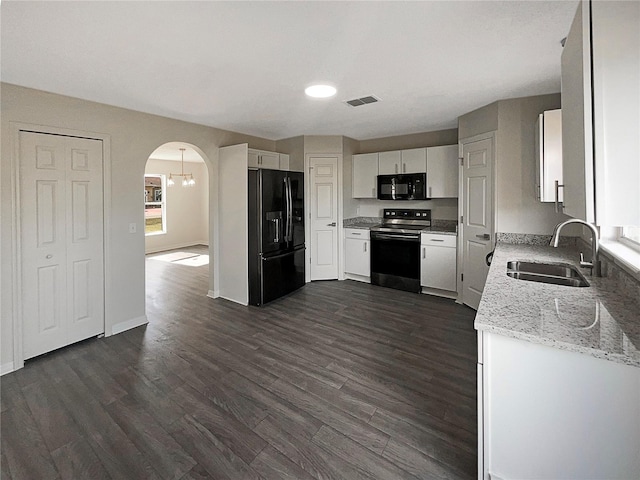 kitchen featuring white cabinetry, dark hardwood / wood-style flooring, black appliances, and sink