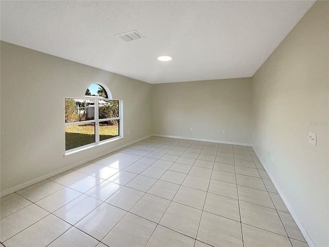 view of tiled spare room