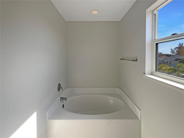 bathroom featuring a tub to relax in