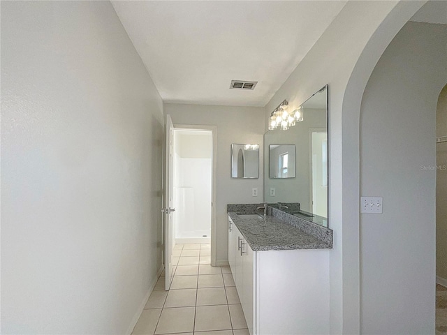 bathroom featuring tile patterned floors and vanity