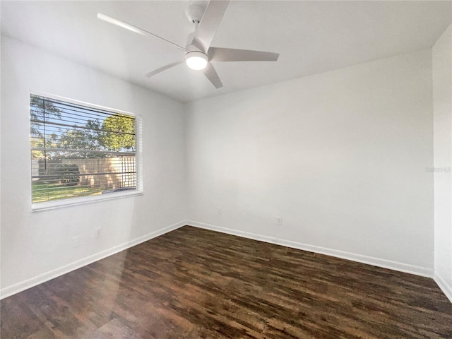 unfurnished room with dark hardwood / wood-style floors and ceiling fan