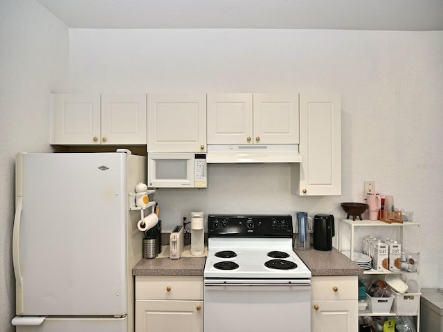 kitchen featuring white cabinets and white appliances