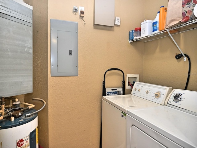 laundry room featuring washer and dryer, electric panel, and water heater