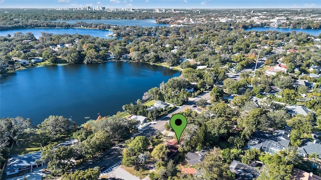 birds eye view of property with a water view