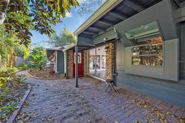 wooden terrace featuring a patio area