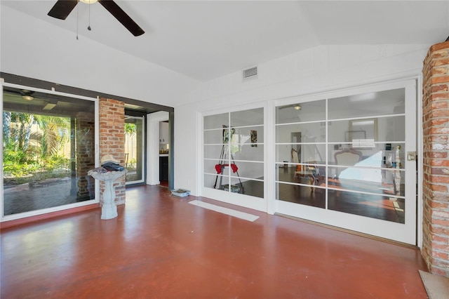 unfurnished sunroom featuring ceiling fan and lofted ceiling