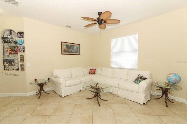 living room with ceiling fan and light tile patterned floors