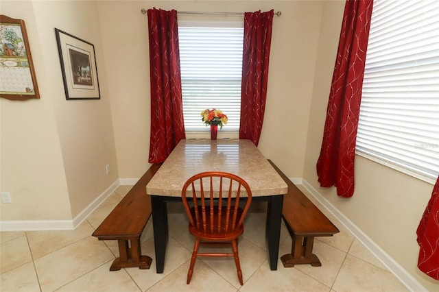 dining space with light tile patterned floors