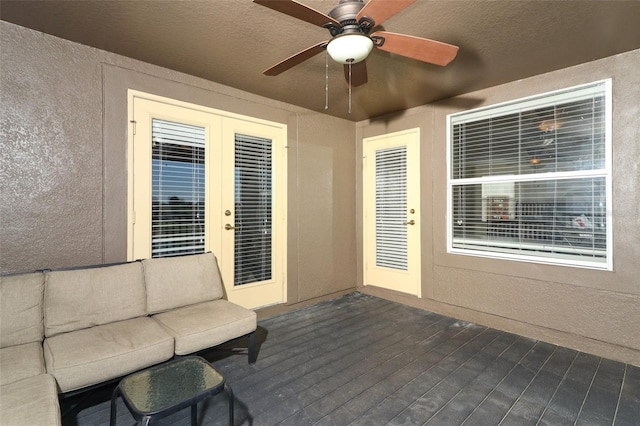 view of patio featuring ceiling fan and a deck