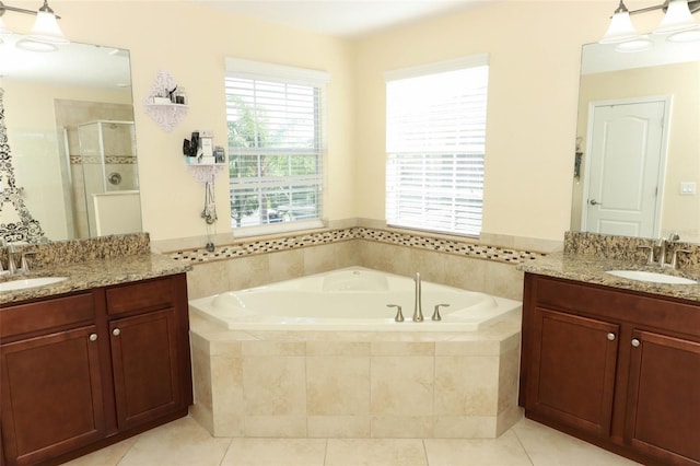 bathroom featuring tile patterned floors, vanity, and independent shower and bath