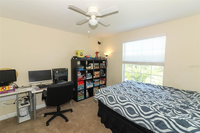 bedroom with ceiling fan and light carpet