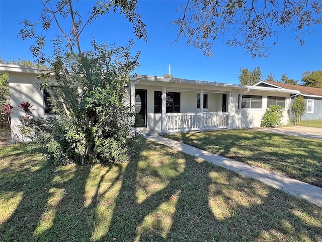 ranch-style home featuring a front yard