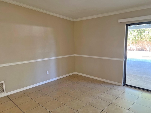 unfurnished room featuring light tile patterned floors and ornamental molding