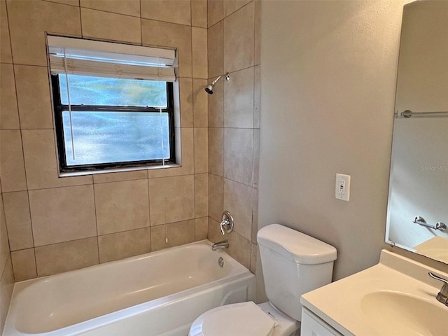 full bathroom with toilet, vanity, and tiled shower / bath combo