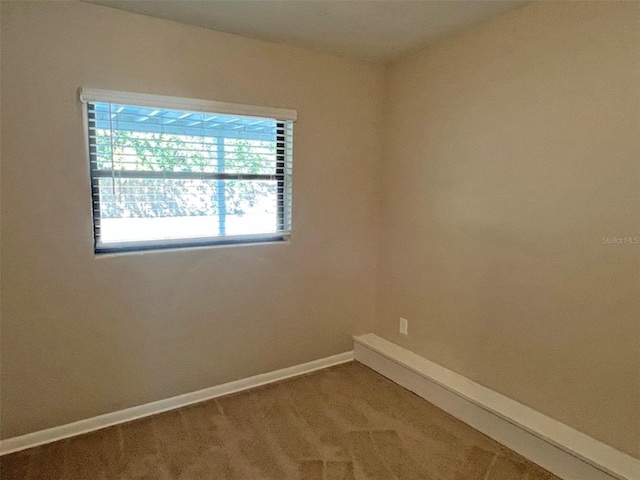 empty room with carpet flooring