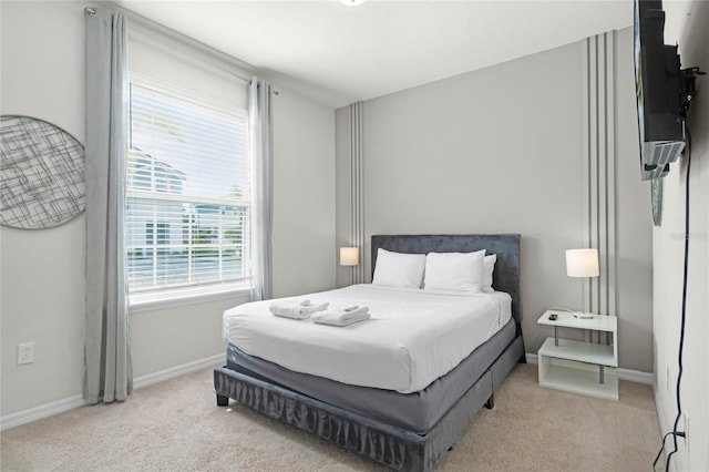 bedroom with light colored carpet