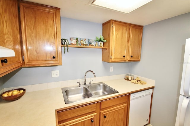 kitchen featuring sink and white appliances