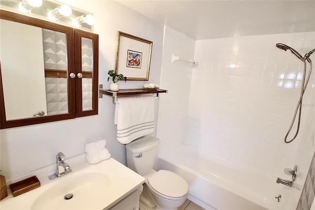 full bathroom with tile patterned flooring, vanity, toilet, and tiled shower / bath combo